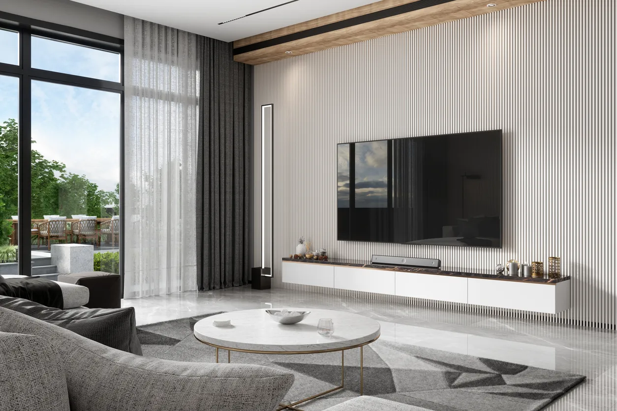 Modern minimalist salon dekorasyonu, gri koltuk ve mermer sehpa.